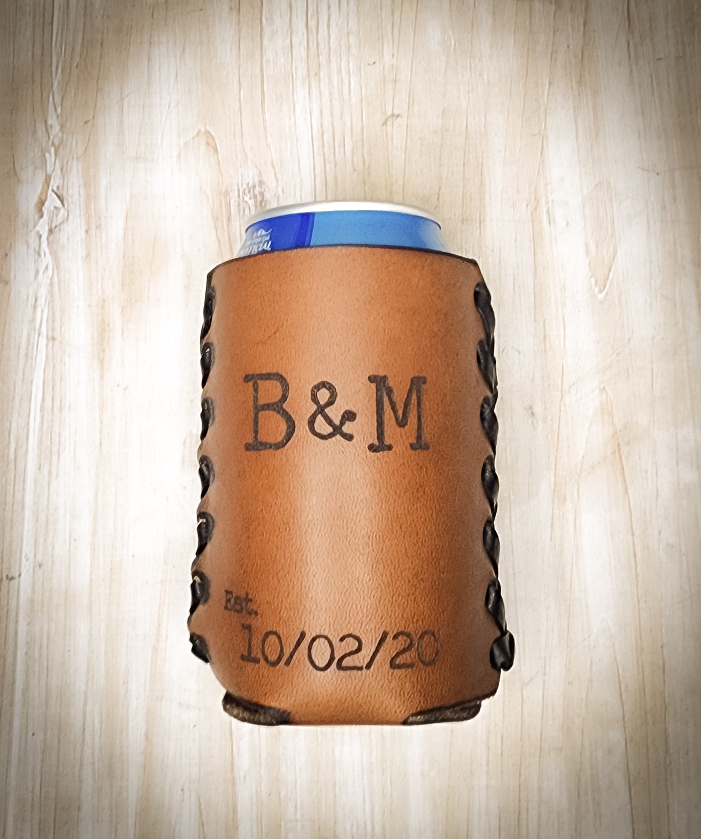 Premium leather anniversary can coozie.