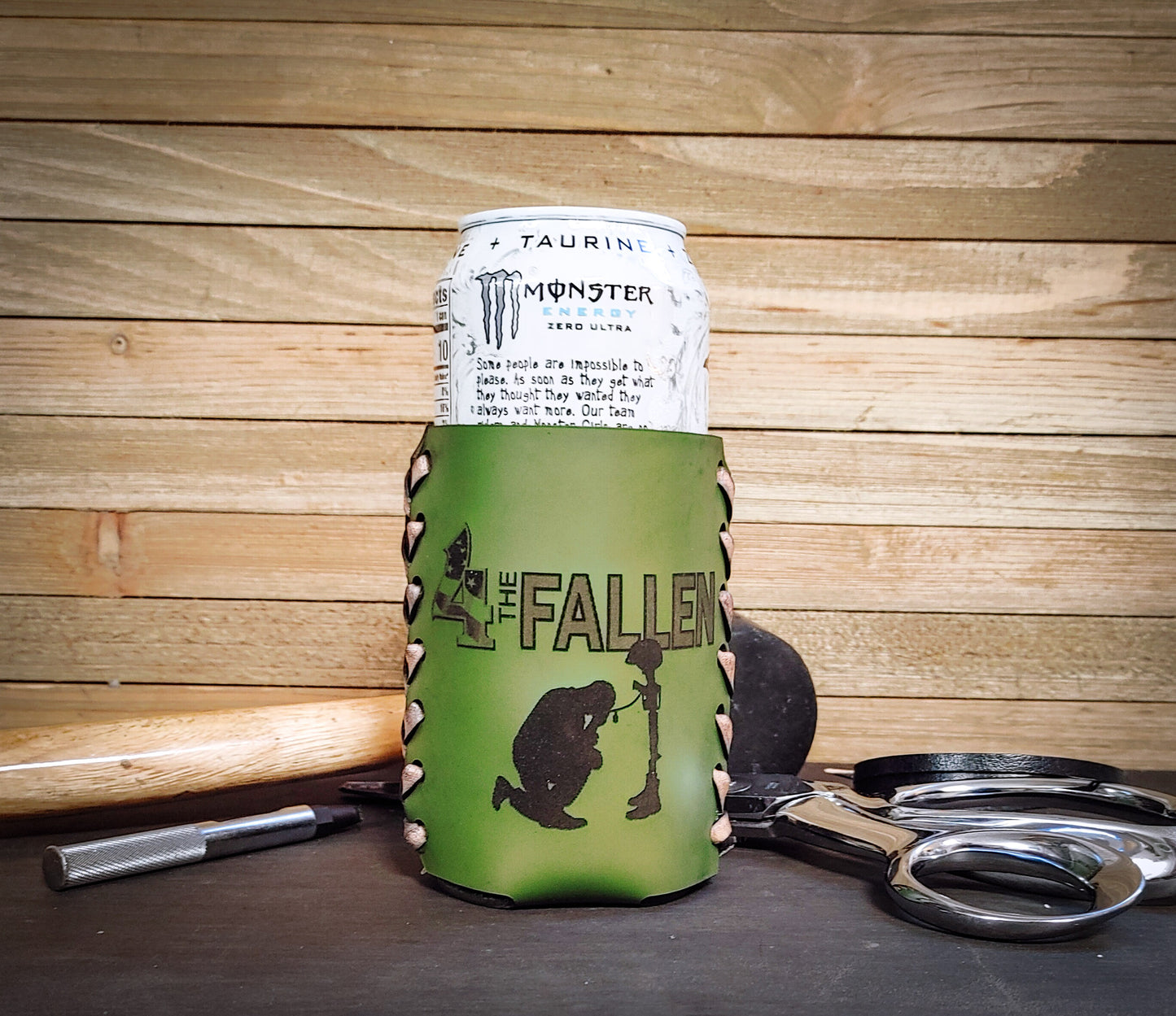 Custom green leather koozie with for the fallen logo wrapped around a monster can gift ideas for veterans