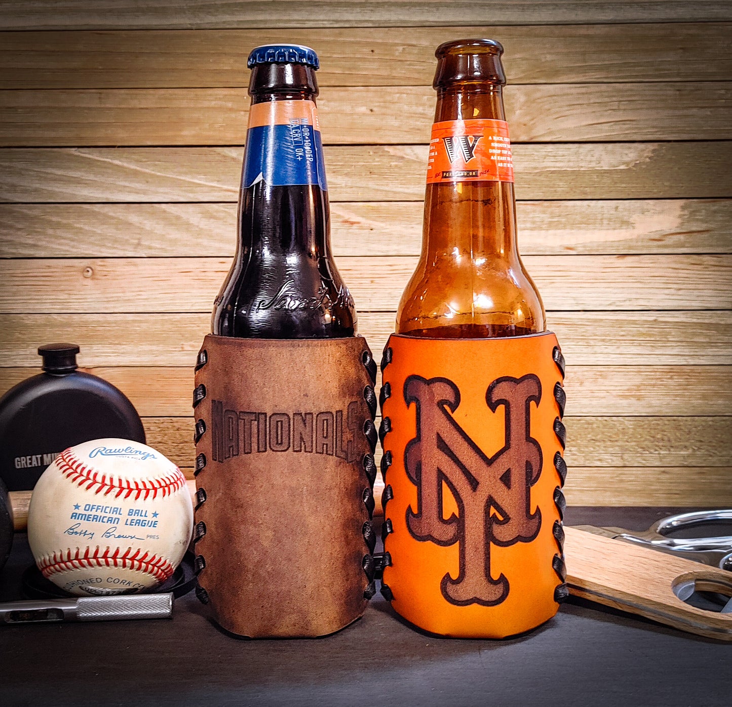 Custom Washington Nationals and New York Mets koozies in tan leather and brown leather wrapped around beer bottles gift ideas for baseball fans